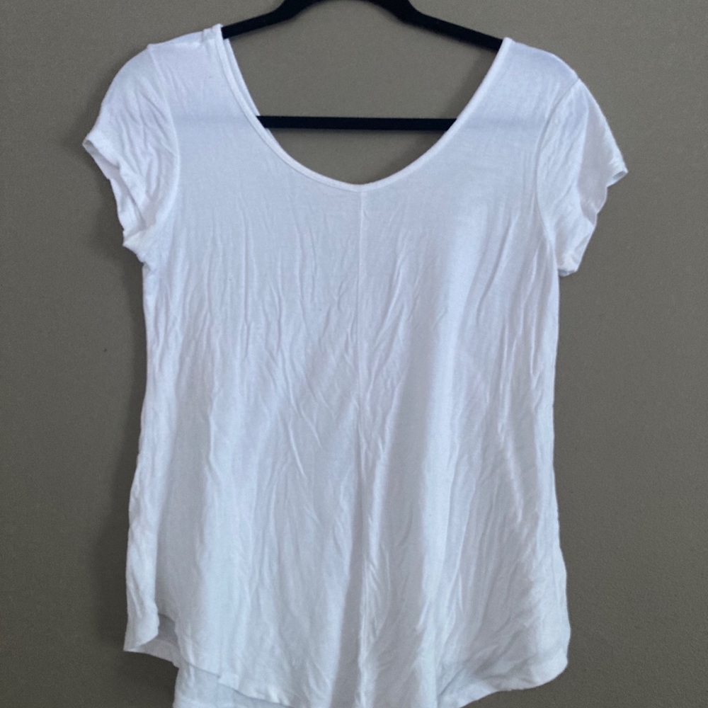 Plain white flowy low cut blouse